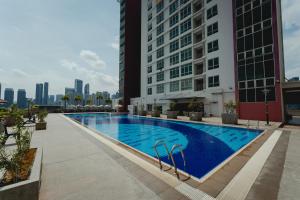 a swimming pool in the middle of a building at UTM Hotel & Residence in Kuala Lumpur