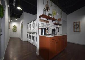 a laundry room with several washing machines and a counter at Rivers Edge Lofts - Unit 7 in Niles