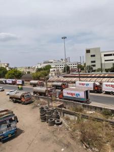 a group of trucks parked in a parking lot at Hotel Dipak in Himatnagar +8 photos