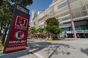 a sign in the street in front of a building at UTM Hotel & Residence in Kuala Lumpur +145 photos