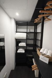 a room with black and white bunk beds at R Platano House in Como +1 photo