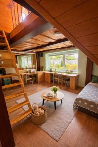 a living room with a bunk bed and a table at House by the sea in Klaipėda
