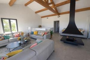 a living room with a couch and a fireplace at Villa MARINE in Ersa