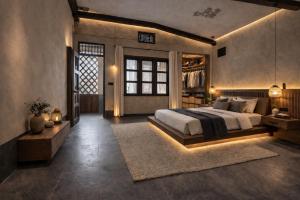 a bedroom with a large bed and a window at Your Sanctuary in Kasese