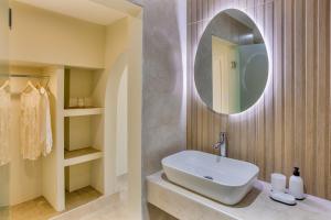 a bathroom with a sink and a mirror at Argo Cozy Studios by Estia in Malia