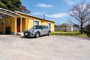 a small car parked in front of a house at Shimabara 結 Terrace in Shimabara +60 photos
