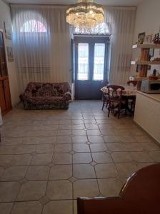 a living room with a couch and a table at Casa Valia in Carloforte