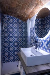 a bathroom with a sink and a shower at Tropea Belle Époque in Tropea +56 photos