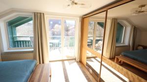 a room with a bed and a large window at Vienna Woods Residence in Gaaden +37 photos