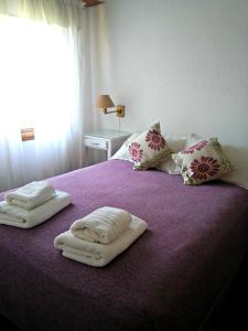 Una cama o camas en una habitación de Hotel Barracuda
