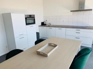 a kitchen with a table with a box on it at Trompstraat Eindhoven in Eindhoven +2 photos
