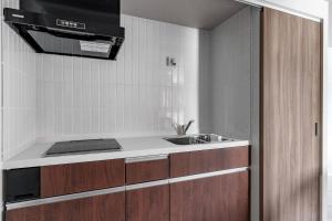a kitchen with a sink and a counter top at Gran Hills in Chitose