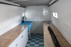 a small room with a sink and a counter at Gjesvaer Fishing in Gjesvær