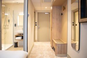a bathroom with a shower and a sink at Brit Hotel Saint Malo – Le Transat in Saint Malo