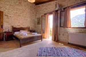 Posteľ alebo postele v izbe v ubytovaní Stone Village Hotel Apartments