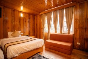 a bedroom with a bed and a window at Verdant The Vintage in Lachung