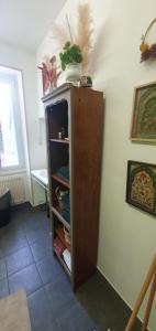 a cabinet in the corner of a room at La Petite Porte Verte in Bouilland