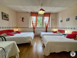 a room with three beds with red pillows at La Maison du Parc in Les Maillys +13 photos