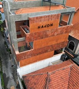 an overhead view of a building with a haron sign on it at Hakon Canggu Boutique Hostel in Canggu