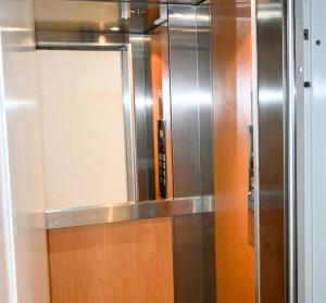 a stainless steel refrigerator in a kitchen at SUMMER Home in Agios Nikolaos