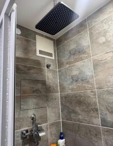 a bathroom with a shower with a ceiling at WKI Company in Mannheim +29 photos