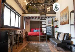 a loft bedroom with a bed and a bunk bed at Rivers Edge Lofts - Unit 5 in Niles
