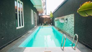 a swimming pool in the middle of a building at 3Apartments in Lagos