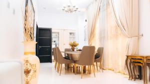 a dining room with a table and chairs at 3Apartments in Lagos