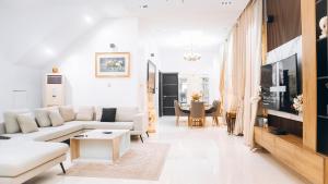 a living room with a couch and a table at 3Apartments in Lagos