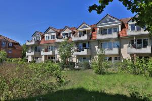 a row of houses on a hill at 2 Zimmer Appartement Poseidon in Boltenhagen