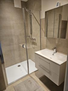 a bathroom with a shower and a sink at Ferienwohnung 2 am Gleichenberger "Kogl" in Bad Gleichenberg