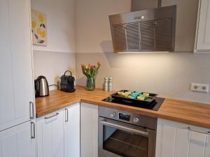 a kitchen with a counter top with a plate of food at Ferienhaus Meerzeit in Gelting