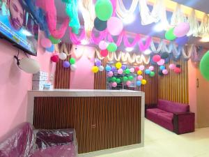 a room with a bunch of balloons on the wall at Hotel Pink Orchid in Chittagong