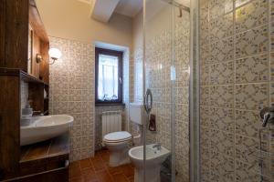 a bathroom with a toilet and a sink and a shower at Agriturismo Terralieta in Roseto degli Abruzzi +198 photos