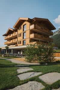 a building with a pathway in front of it at Boutiquehotel Acherl in Achenkirch