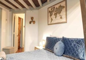 a bedroom with a bed with a blue pillow on it at Rivers Edge Lofts - Unit 4 in Niles