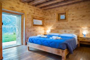 Llit o llits en una habitació de Albergo Diffuso Sutrio Zoncolan