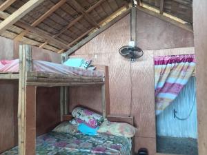 a bedroom with two bunk beds in a room at RENDER VOUS A'l MER in Puerto Princesa City +19 photos