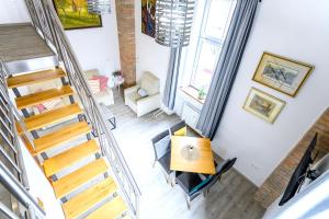 an overhead view of a room with a table and a staircase at The LOFT Ljubljana in Ljubljana