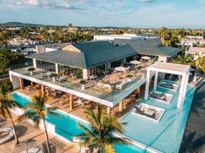 an aerial view of a resort with a pool at Van der Valk Plaza Resort Bonaire - All Inclusive in Kralendijk