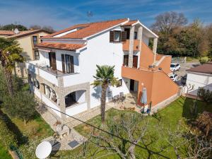 an aerial view of a house with a yard at Apartments Koraca in Poreč