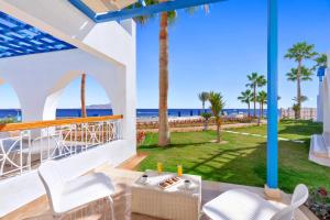 a view of the beach from the balcony of a villa at Pickalbatros Palace Sharm "Aqua Park"- All inclusive in Sharm El Sheikh