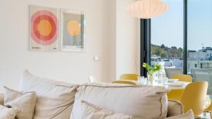 a living room with a couch and a table at ALLONBAY dream apartment in Villajoyosa +36 photos