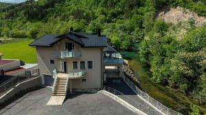 an aerial view of a house with a balcony at Villa Boomerang in Srbljani