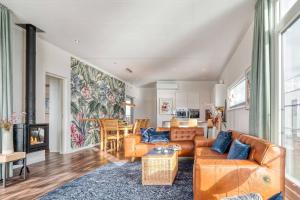 a living room with a couch and a table at Floatinghouse Große Freiheit in Ribnitz-Damgarten