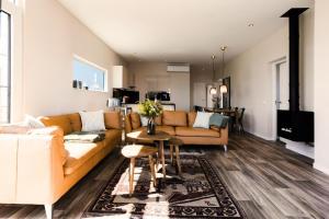 a living room with a couch and a table at Floatinghouse Meerkraft in Ribnitz-Damgarten