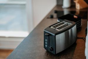 a black toaster sitting on top of a counter at Floatinghouse Seeblick - LP7 in Vetschau
