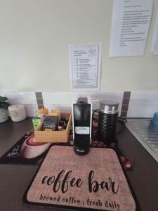 a coffee bar on a kitchen counter with a coffee maker at La Casita Preston Beach in Preston Beach +26 photos