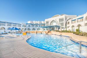 a swimming pool in the middle of a building at Pickalbatros Palace Sharm "Aqua Park"- All inclusive in Sharm El Sheikh +165 photos
