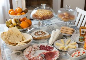 a table topped with lots of different types of food at S'Ispera B&B, Home Restaurant, Autentiche Esperienze Sarde in Fonni